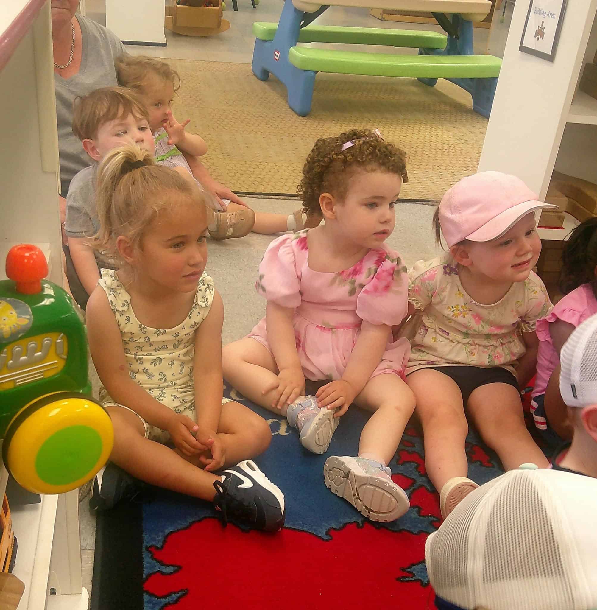 Toddlers exploring and playing in the Tadpoles classroom at Boxboro Children Center